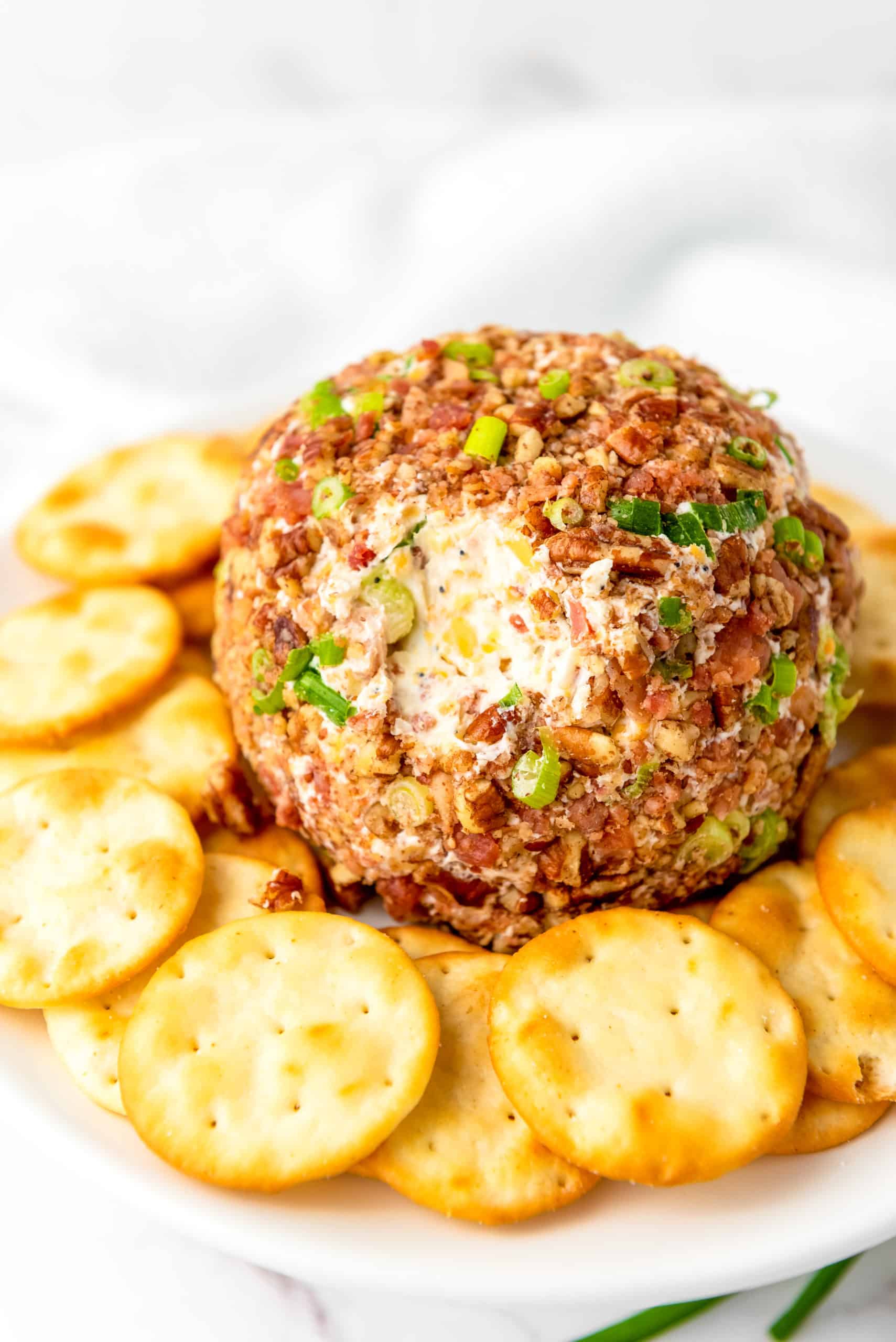 pecan bacon cheese ball served with butter round crackers