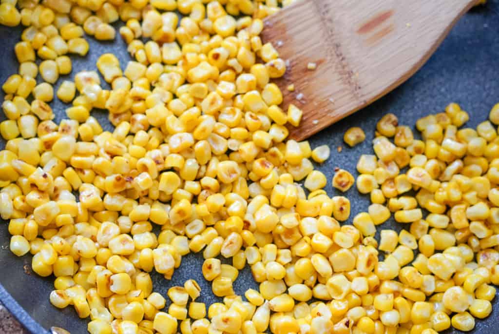 corn cooked in a skillet with butter