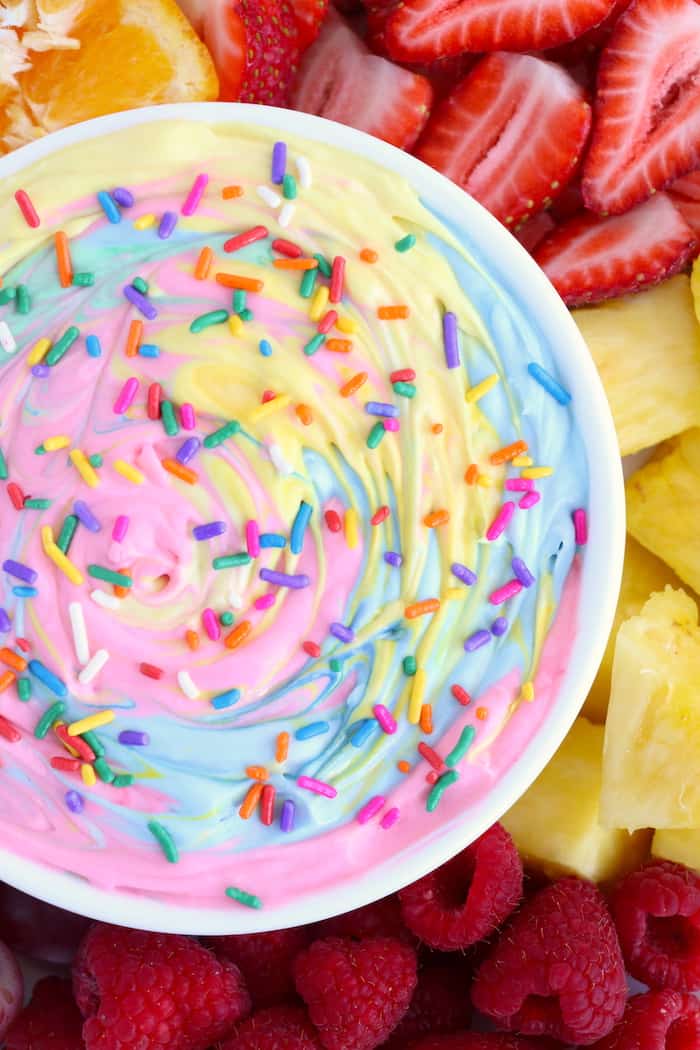 colorful rainbow fruit dip with fruit on the side