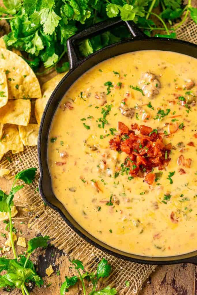 photo looking down on smoked queso dip in a cast iron skillet