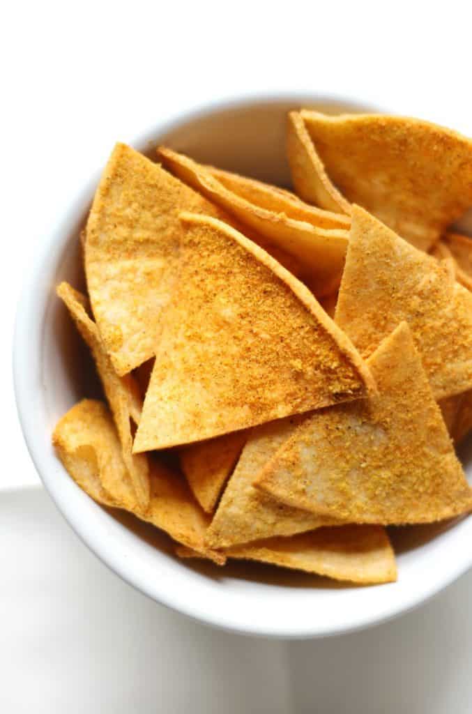 homemade vegan doritos in a white bowl