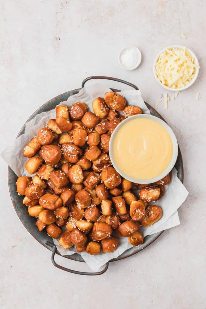 pretzel bites on a serving tray with honey mustard dipping sauce