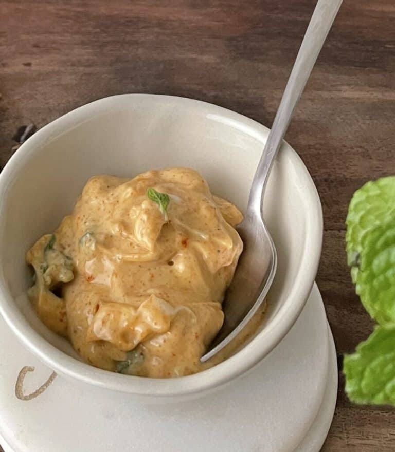homemade tandoori mayo in a white bowl with a spoon