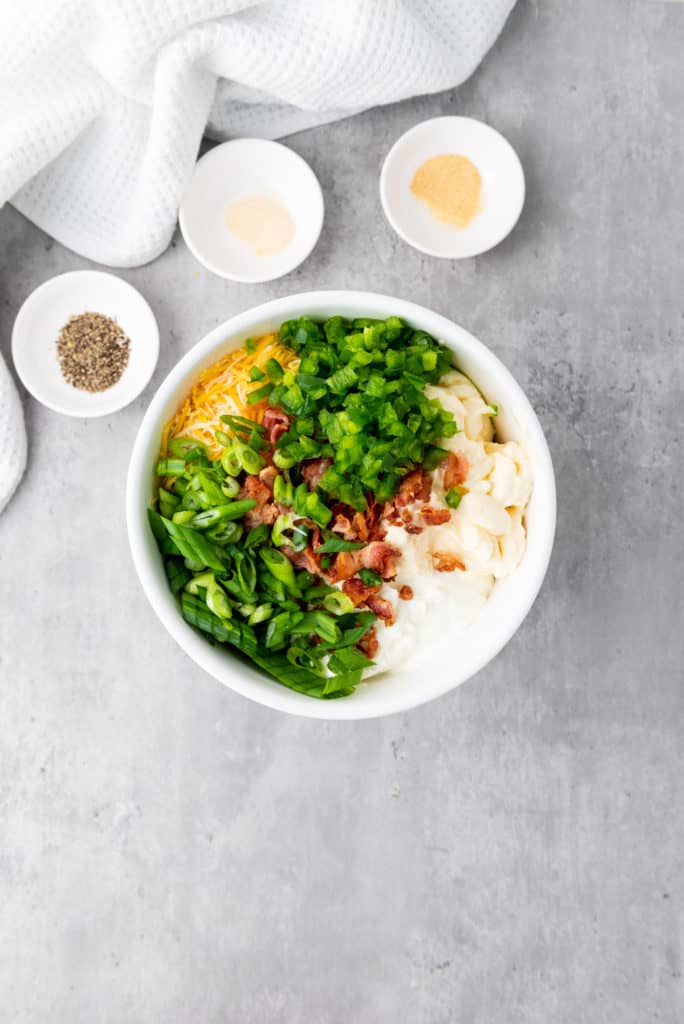Ingredients being mixed together for a delicious and easy to make creamy corn dip recipe