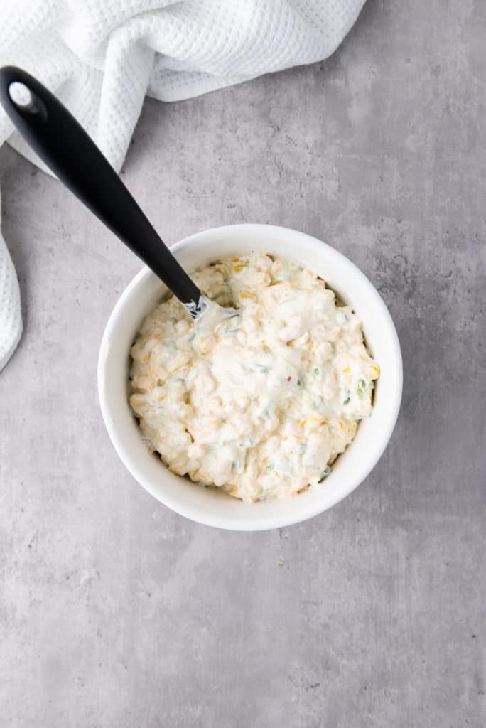 easy to make creamy corn dip recipe combined in a white bowl
