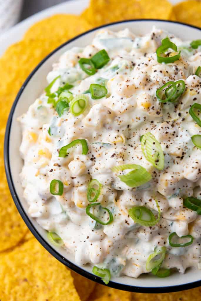 corn dip closeup photo with tortilla chips