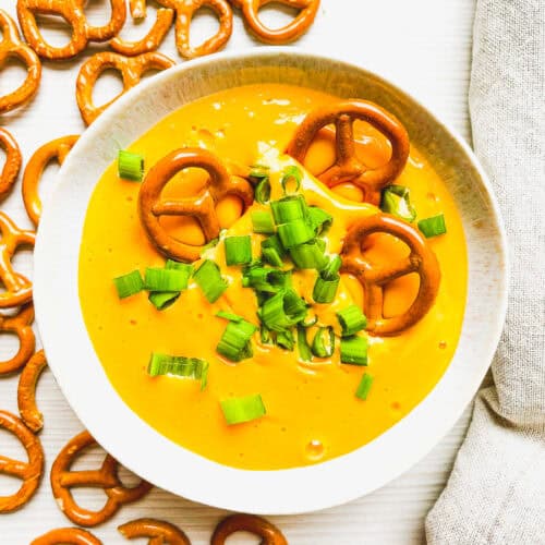 beer cheese dip for pretzels prepared with pretzels on the side for dipping