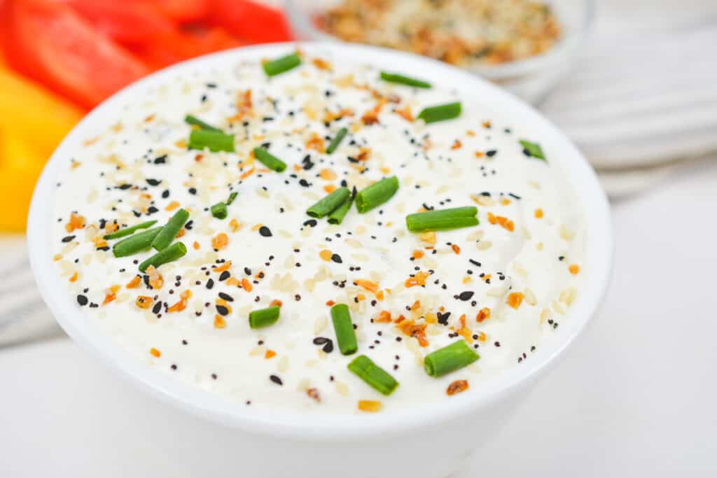 Closup shot of bowlful of eveyrthing bagel dip