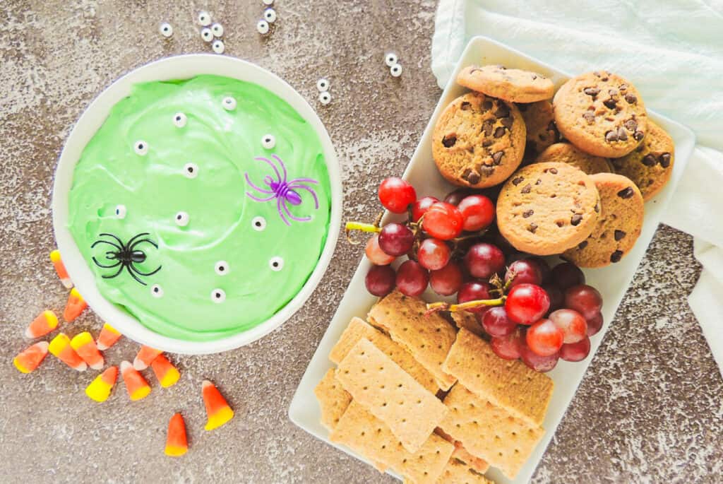 serving ideas for Halloween dessert dip include chocolate chip cookies, grapes, and graham crackers
