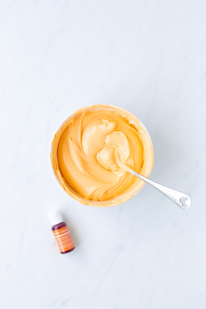 orange food coloring mixed with vanilla icing