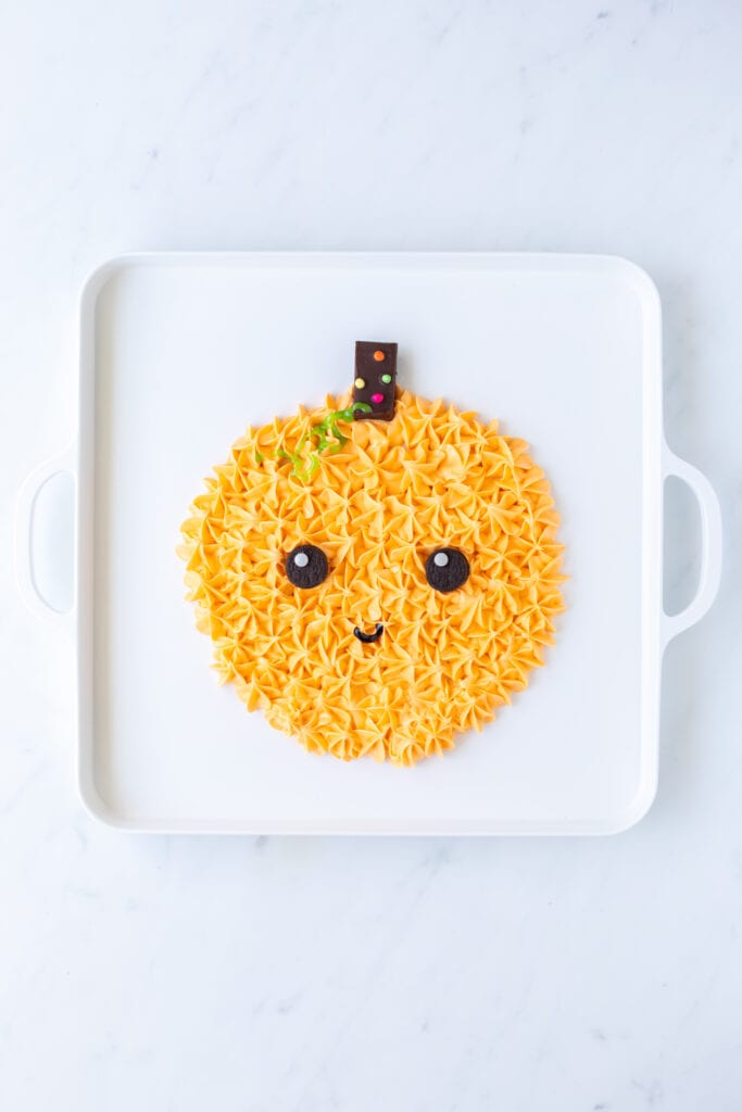 orange frosting pumpkin with cosmic brownie stem