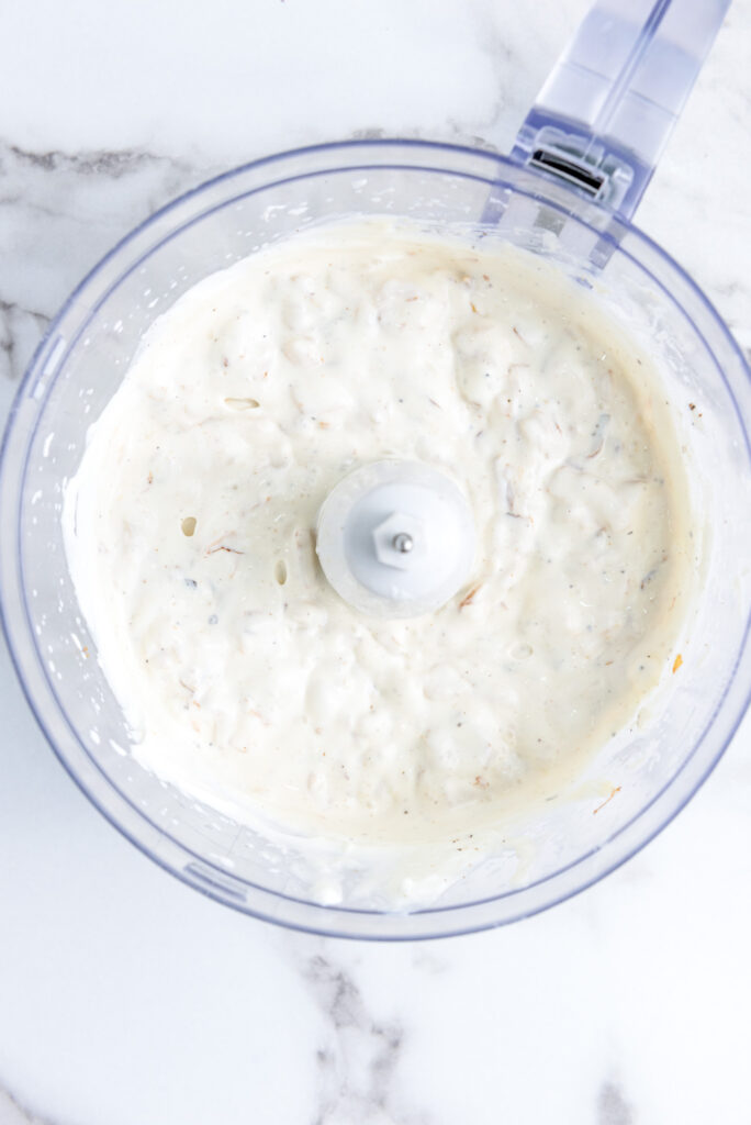 onion dip ingredients mixed in a food processor
