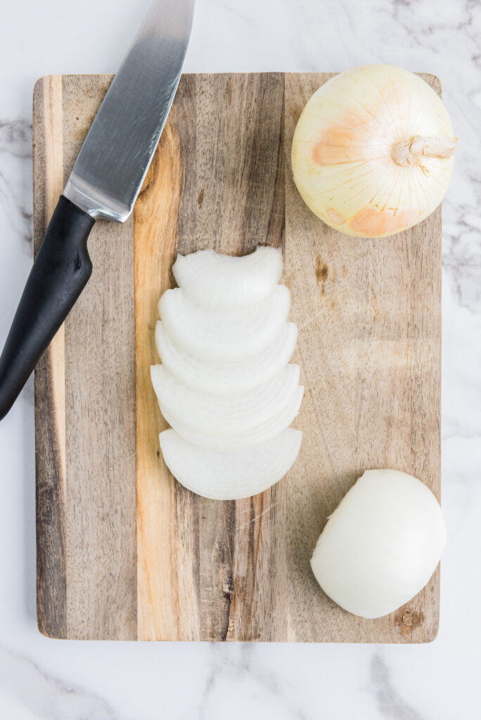 sliced onions on a cutting board