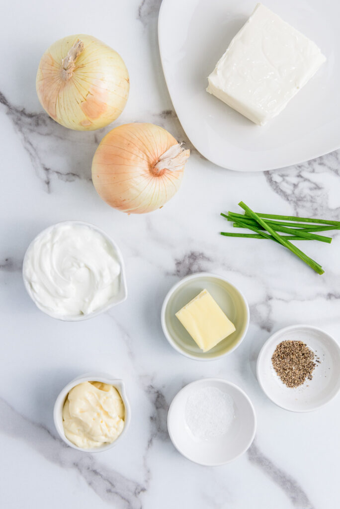 ingredients laid out on a counter for caramelized onion dip 