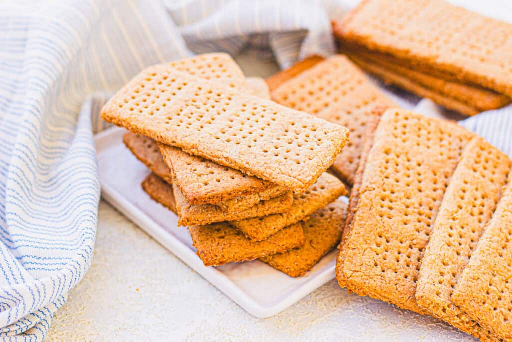 pile of made from scratch graham crackers on a counter