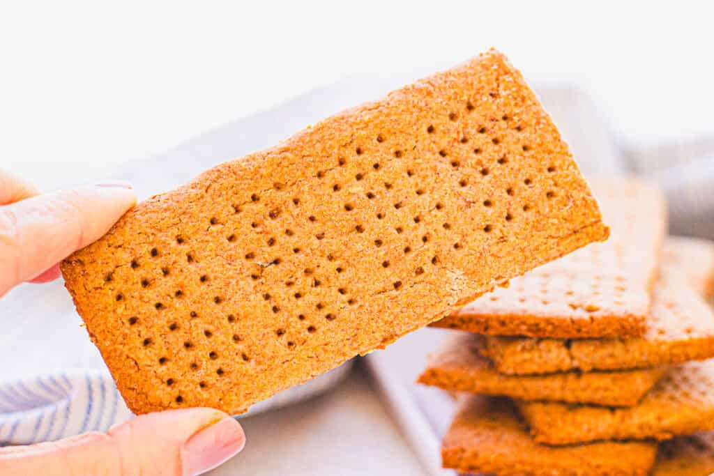 hand holding homemade graham cracker