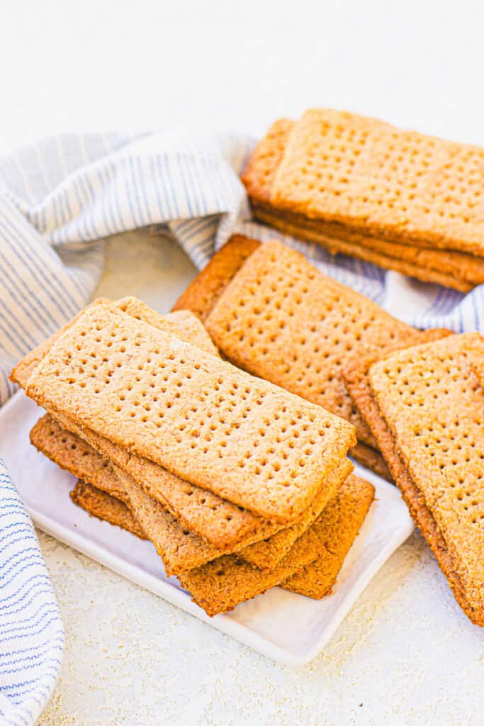homemade graham cracker recipe with crackers stacked on a table