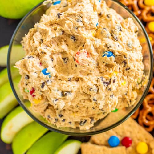 prepared monster cookie dough dip with sliced apples, pretzels dippers on the side