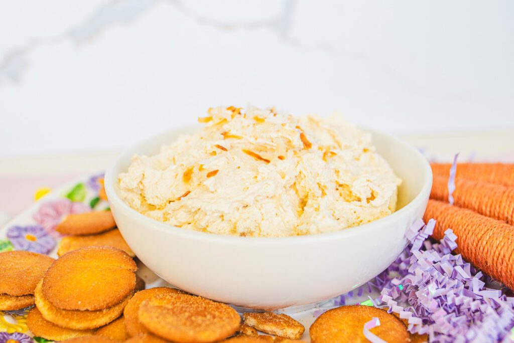 coconut cream dip with toasted coconut in a white bowl