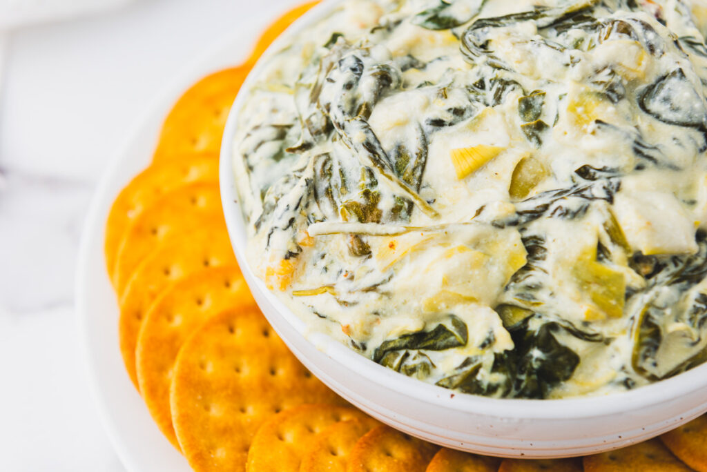closeup photo of spinach artichoke dip made in a crockpot