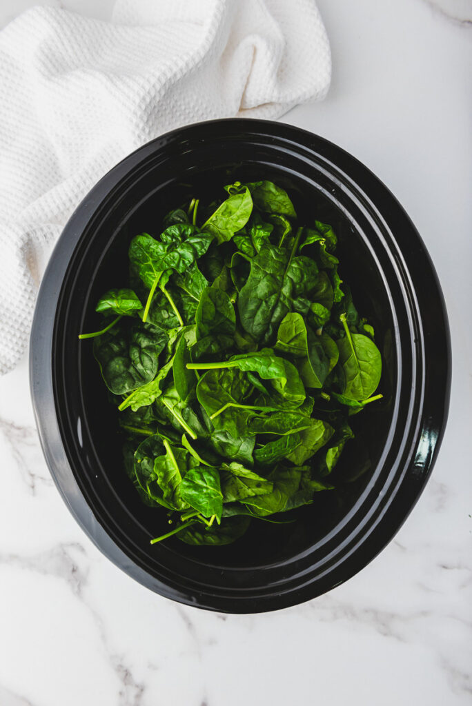 spinach on top of dip in crockpot