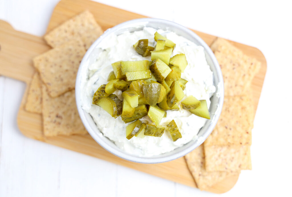 overhead photo of pickle dip with chopped pickles and tortilla chips on the side