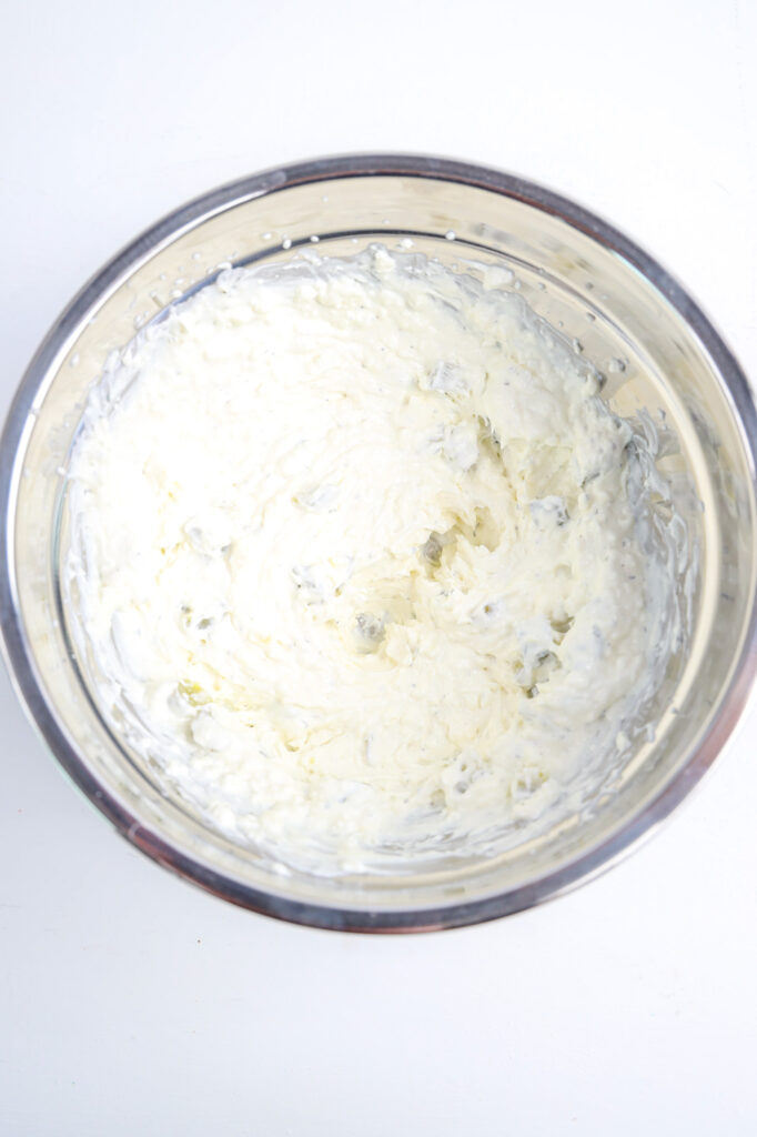 fully combined dill pickle dip in a mixing bowl 