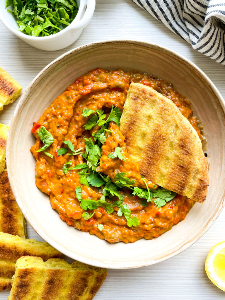 moroccan zaalouk with pita bread dipper