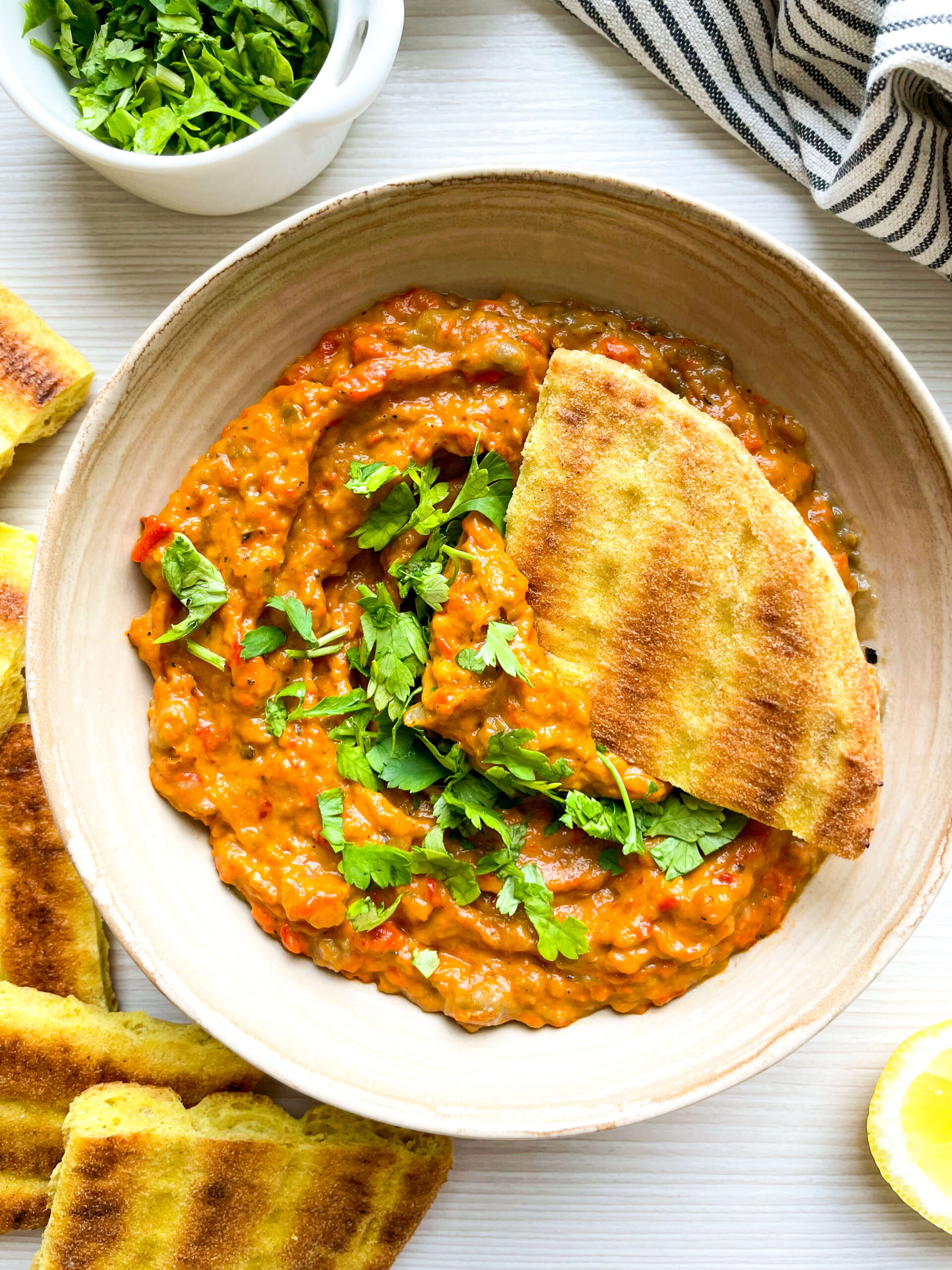 close up of zaalouk with pita dipper
