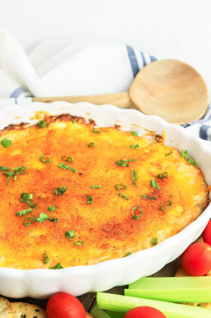 hot crab dip with cajun seasoning fully prepared in a baking dish, ready to serve