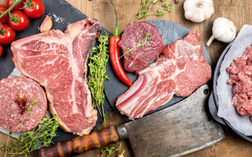 Top view of meat with garlic and herbs