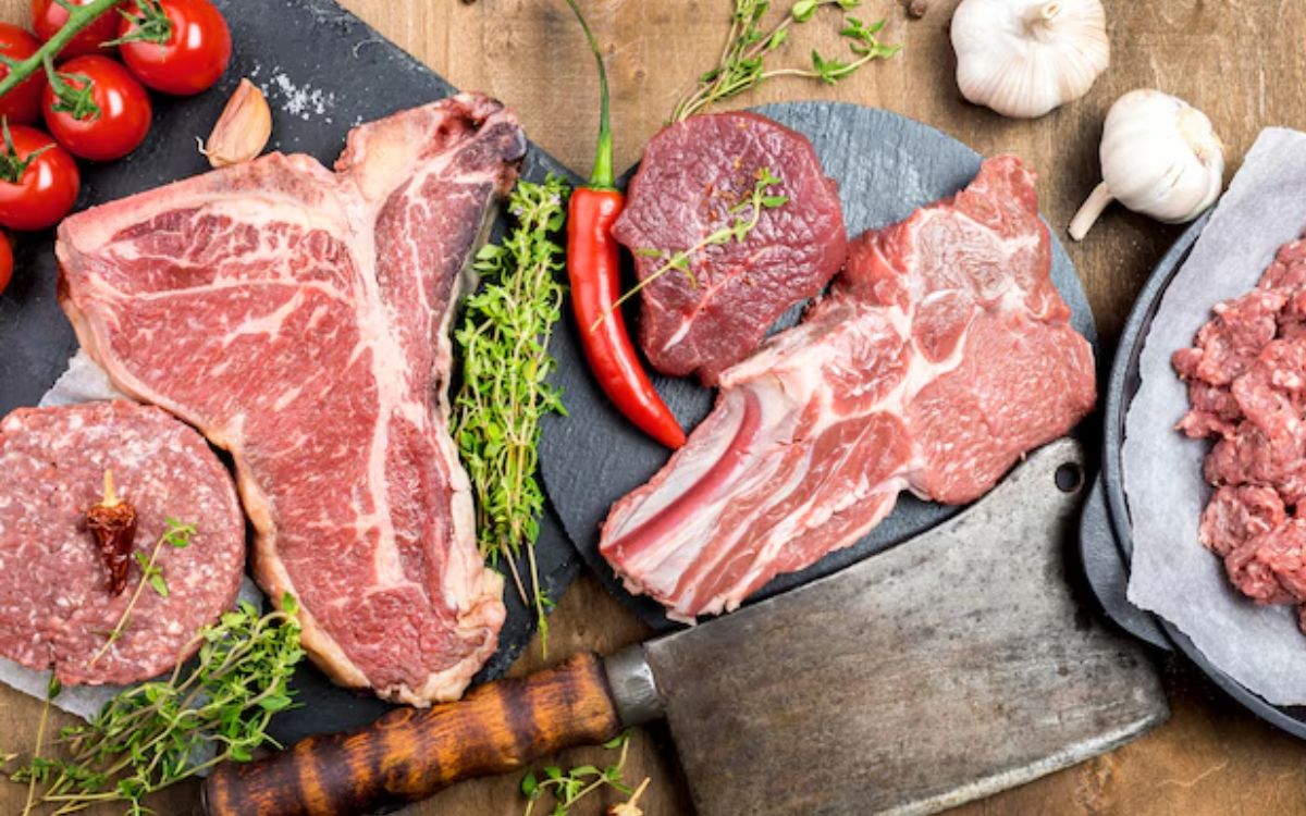 Top view of meat with garlic and herbs