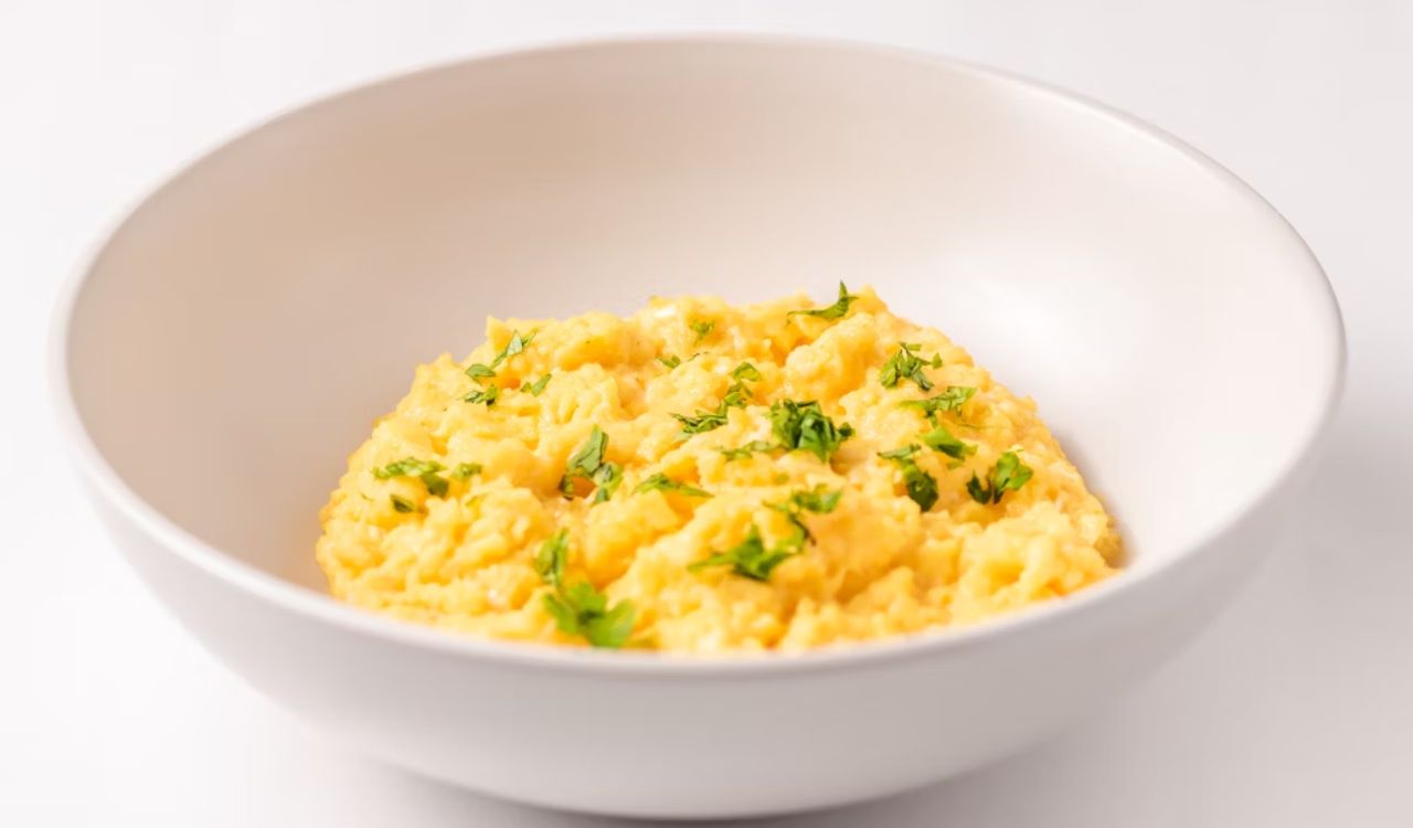 A close-up of a bowl of scrambled eggs