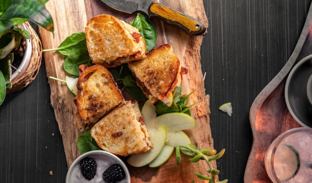 A food picture of grilled cheese sandwich and berries