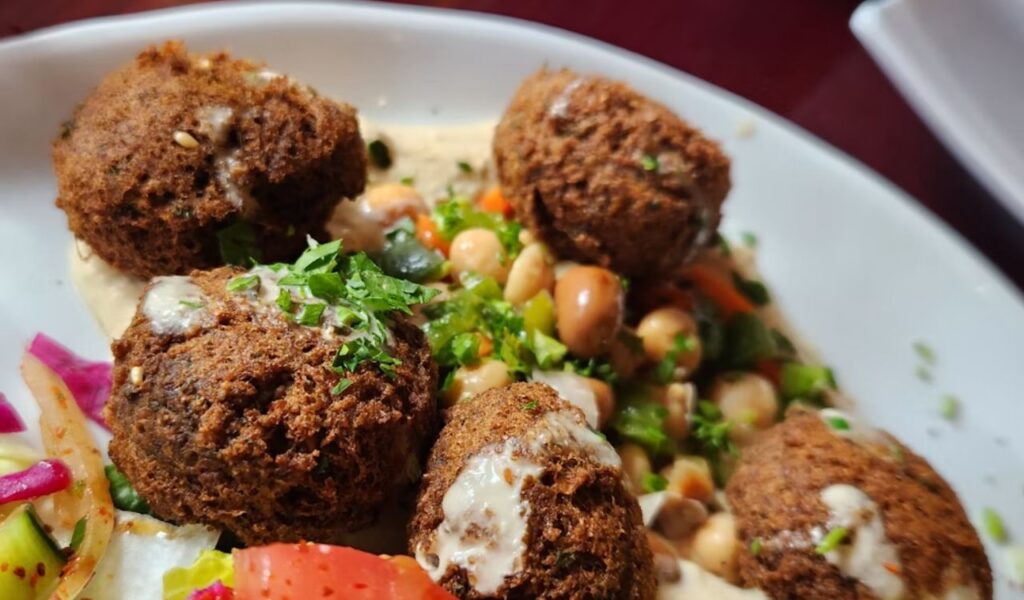 A hearty and delicious falafel served on a bed of fragrant rice