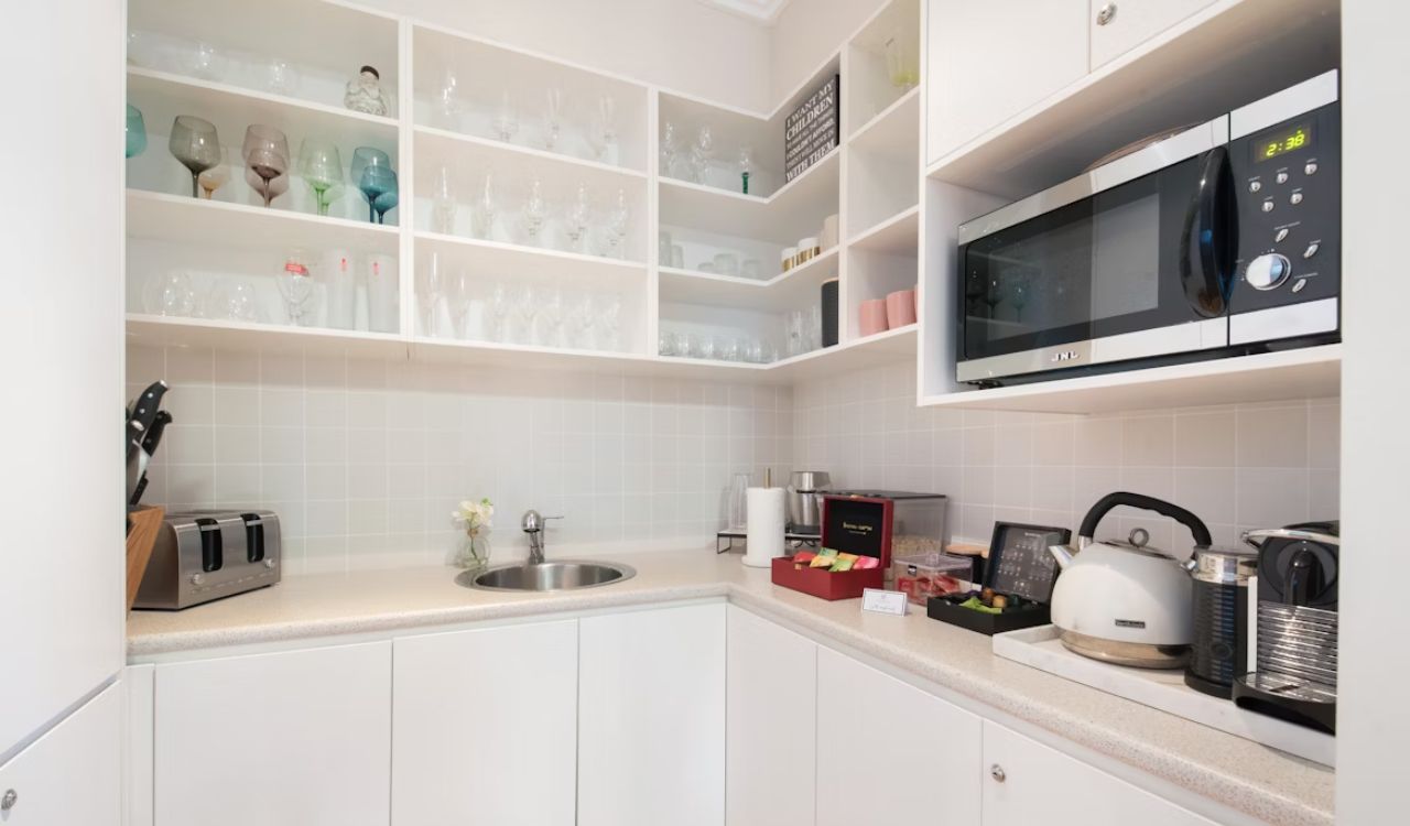 A kitchen with microwave oven