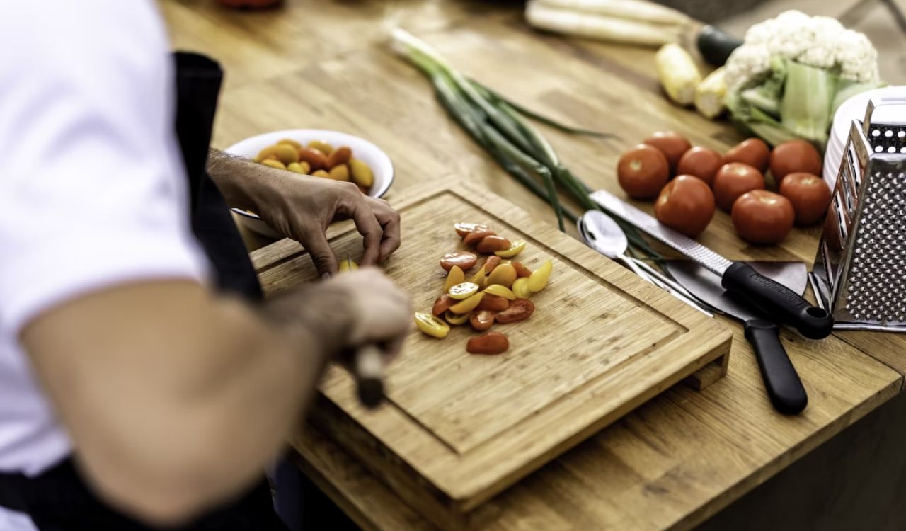 A person cutting up vegetables