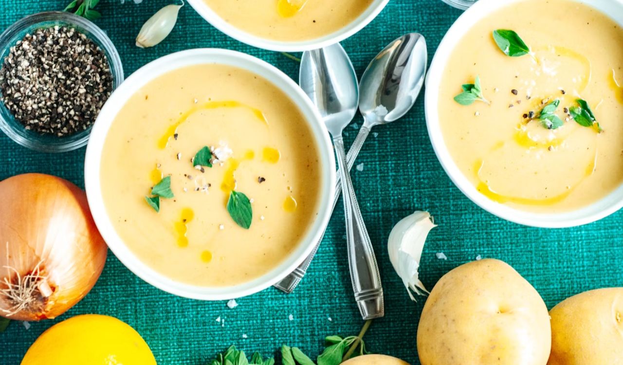 A table topped with bowls of soup