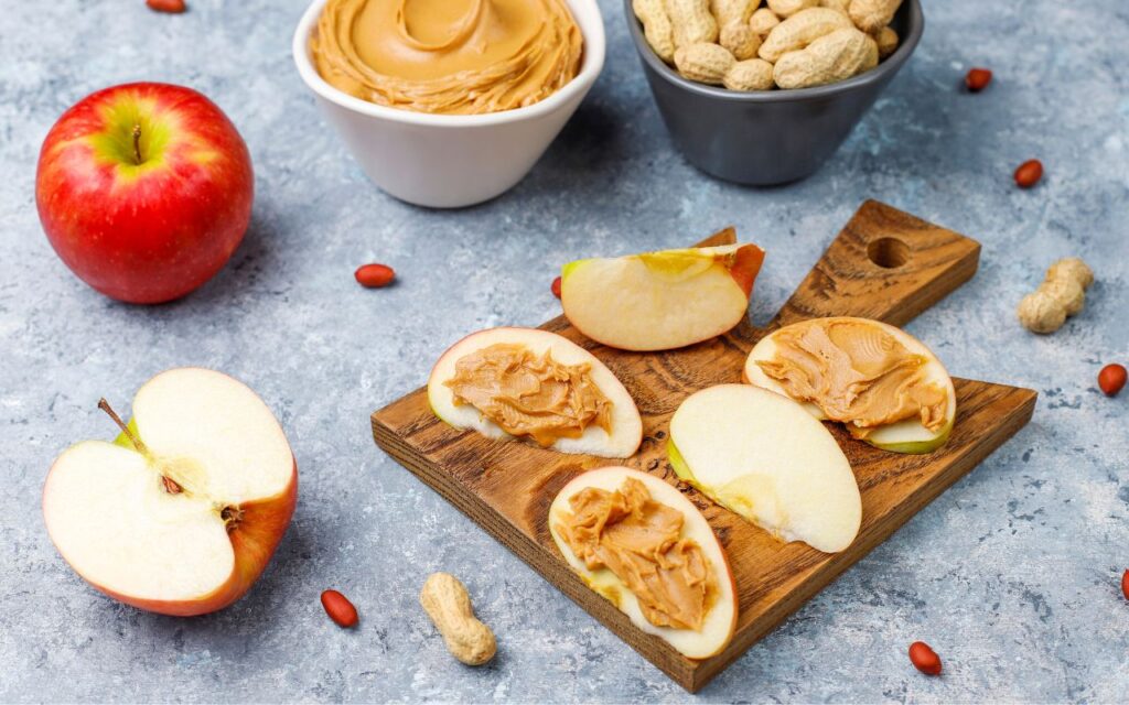 Sliced apples topped with creamy peanut butter