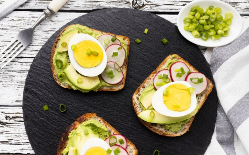 Top view of sandwiches with egg and avocado