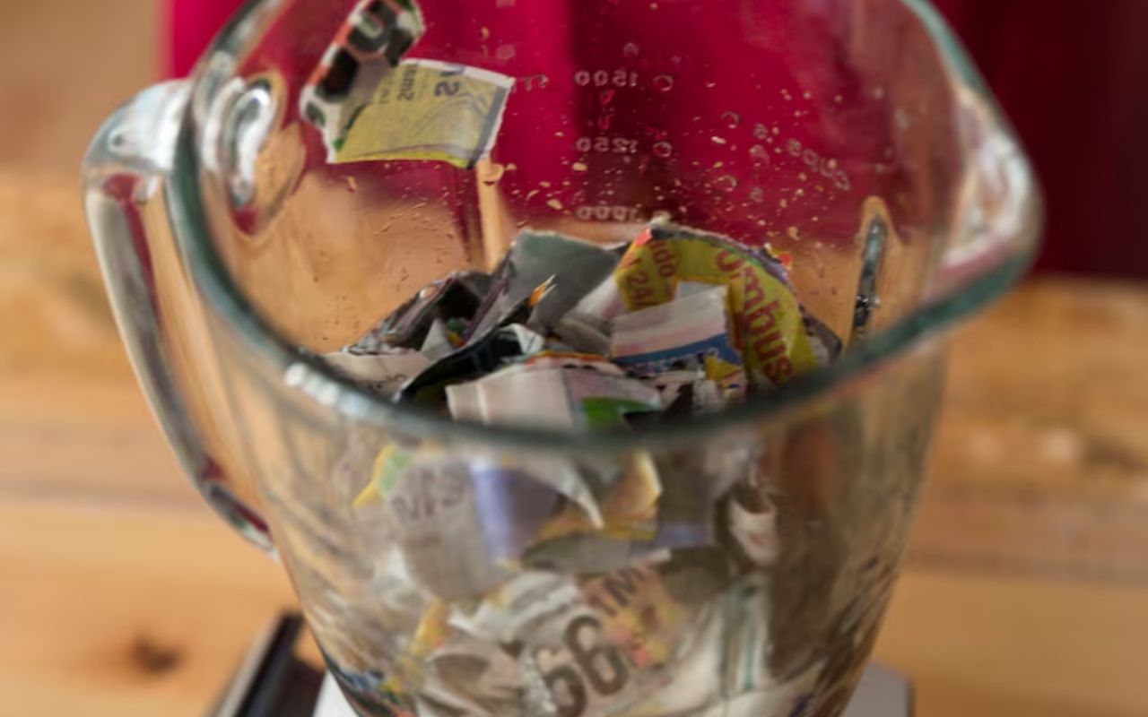 Blender containing torn pieces of paper