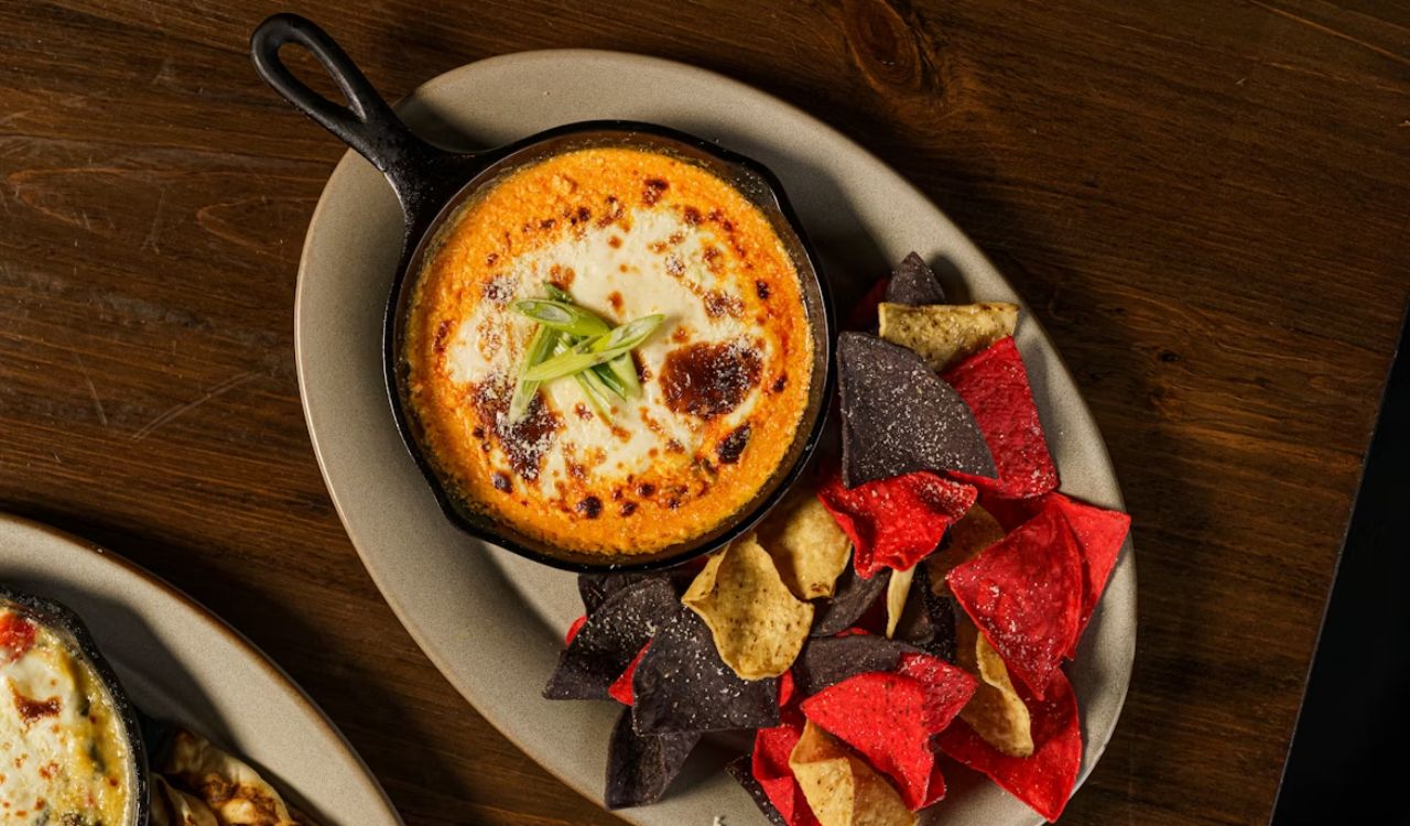 Buffalo chicken dip on a wooden table