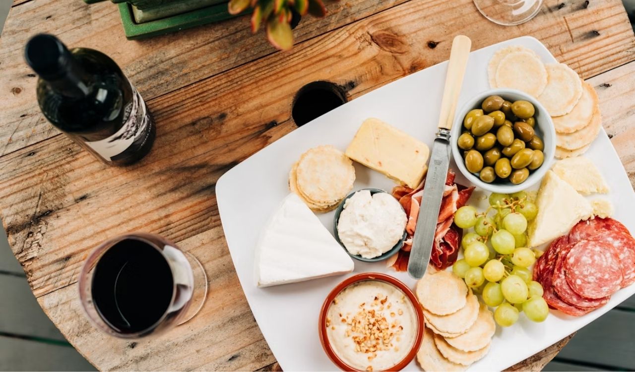 Cheese and wine with fruits and meats