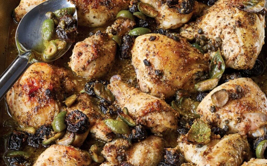 Baked Chicken Marbella with olives, prunes, and capers in a savory sauce