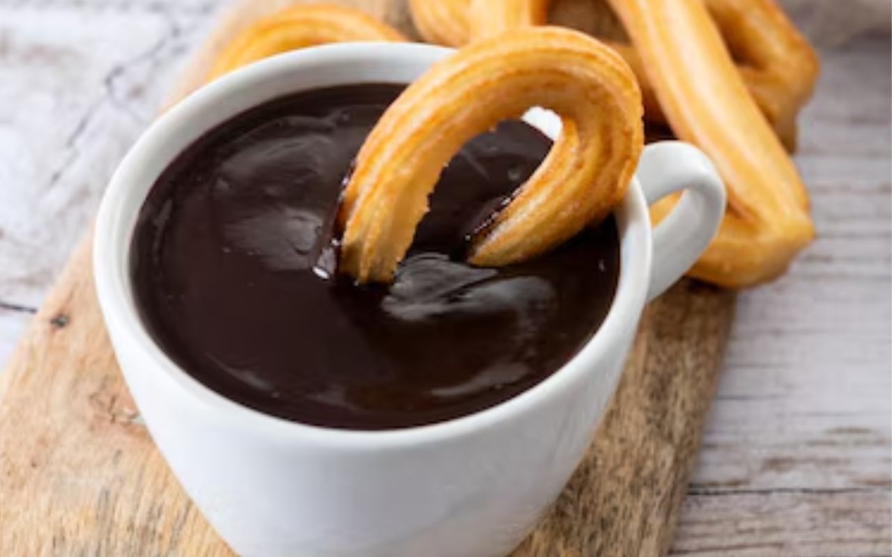 Churros dipped in thick hot chocolate