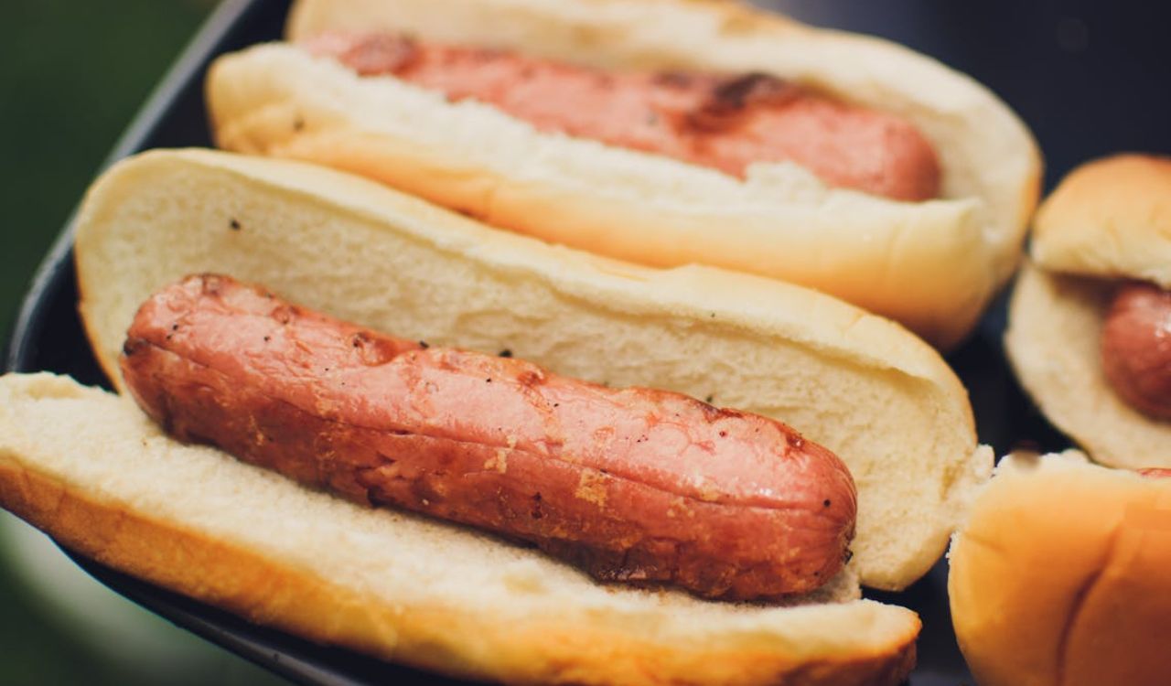 Close-Up of Grilled Hot Dogs in Buns