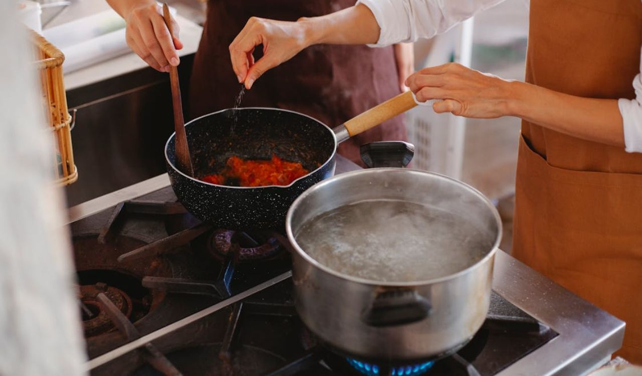 Close Up of Women Hands Stir in Pot