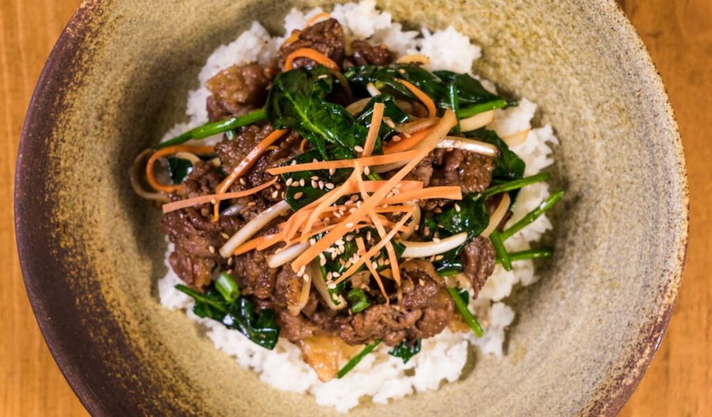 Close-up Photo of Scrumptious Meat Dish Topped on Rice
