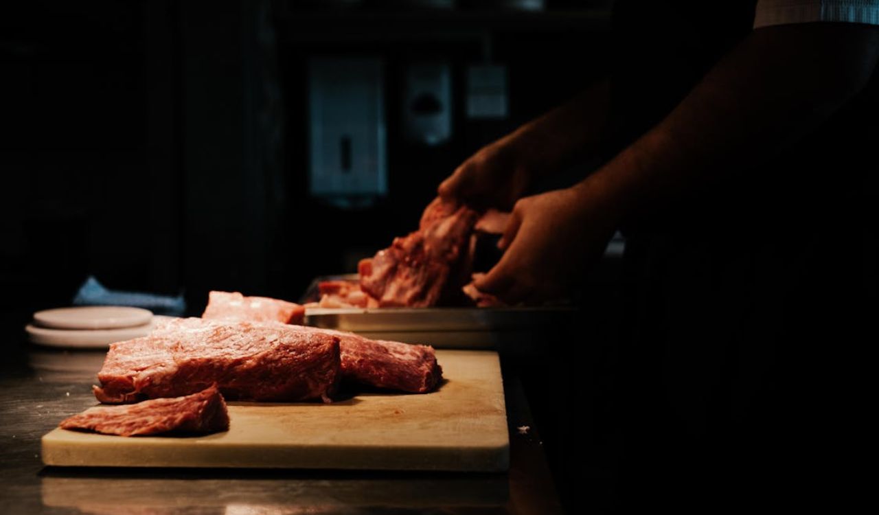 Close-up of Chef Working with Meat