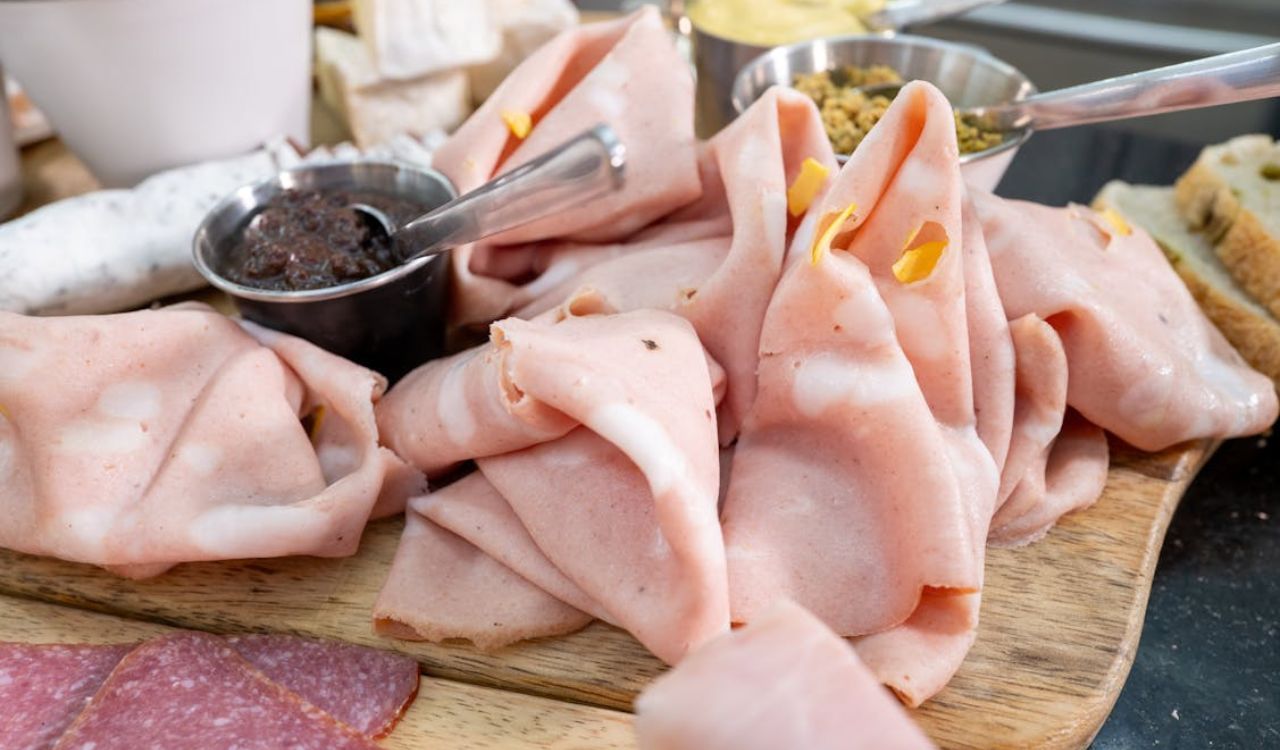 Close-up of Mortadella an Sauces on a Wooden Board